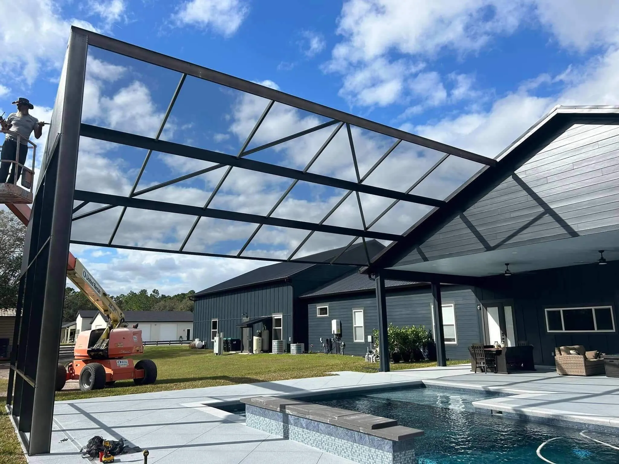 backyard pool cage enclosure installed at residential house