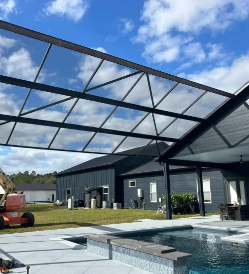 backyard pool cage enclosure installed at residential house