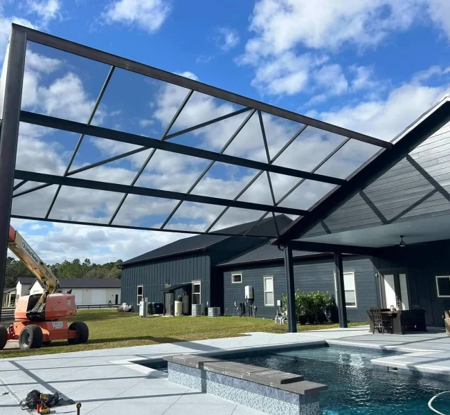 backyard pool cage enclosure installed at residential house