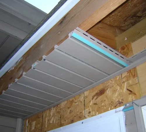 Technicians installing soffit and fascia