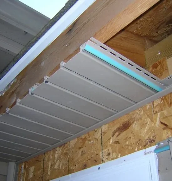 Technicians installing soffit and fascia