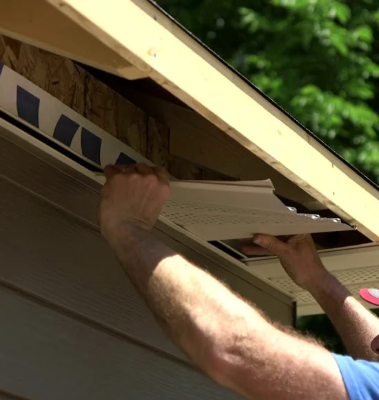 Soffit panel installation under roof eaves